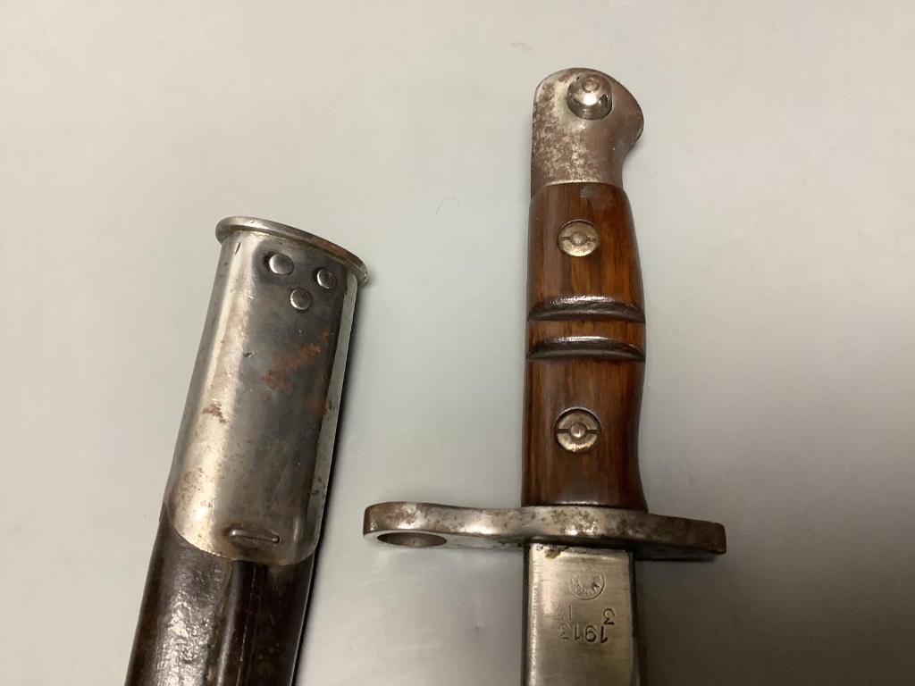 A WWII bayonet, blade marked ‘1913 3 17 REMINGTON’